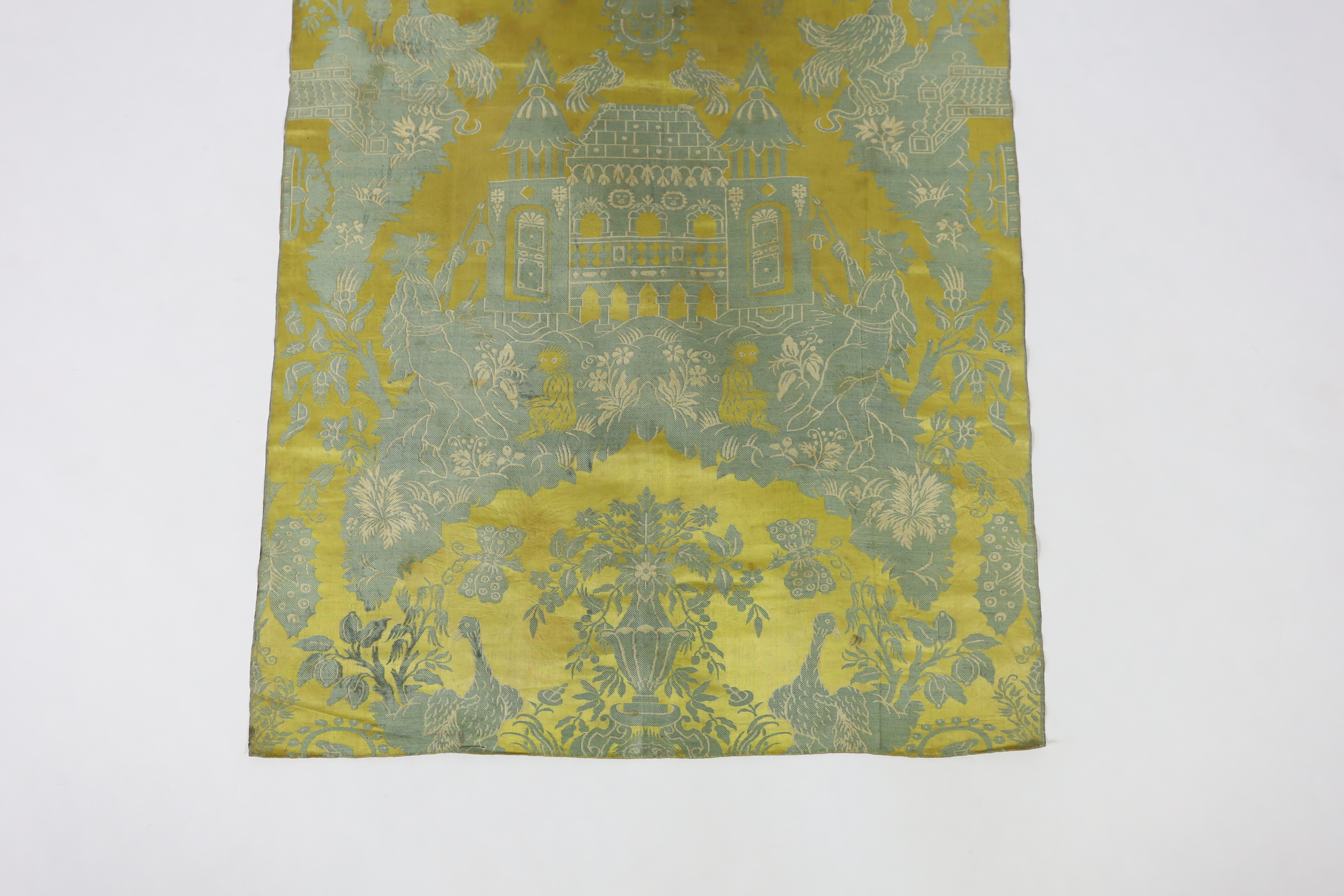 A large 19th century chinoiserie silk two colour damask panel, possibly Lyon, with large repeat, woven in turquoise on gold silk, with cream outlines, 130cm long, 74cm wide